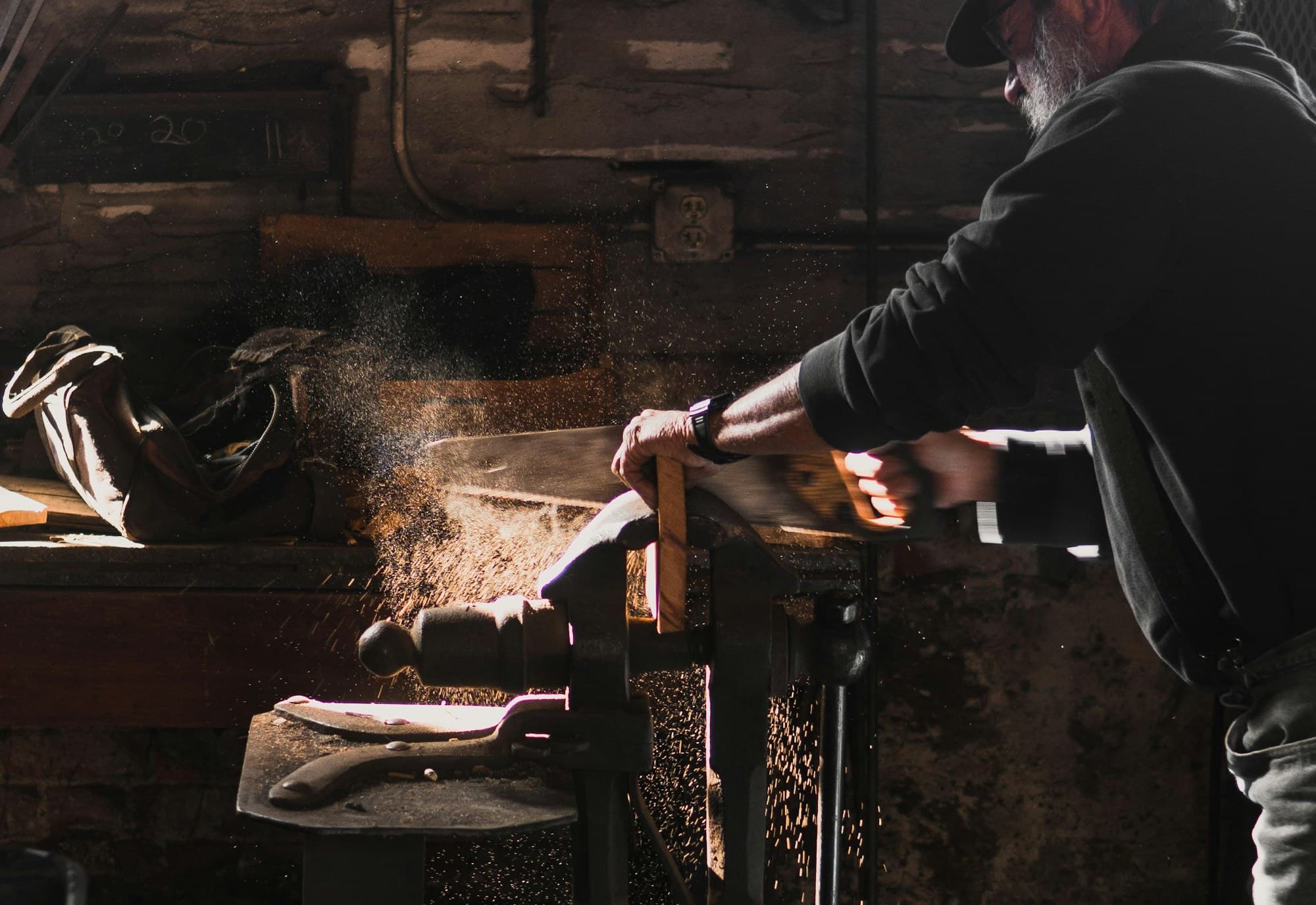 A furniture workshop with benches, timber and tools